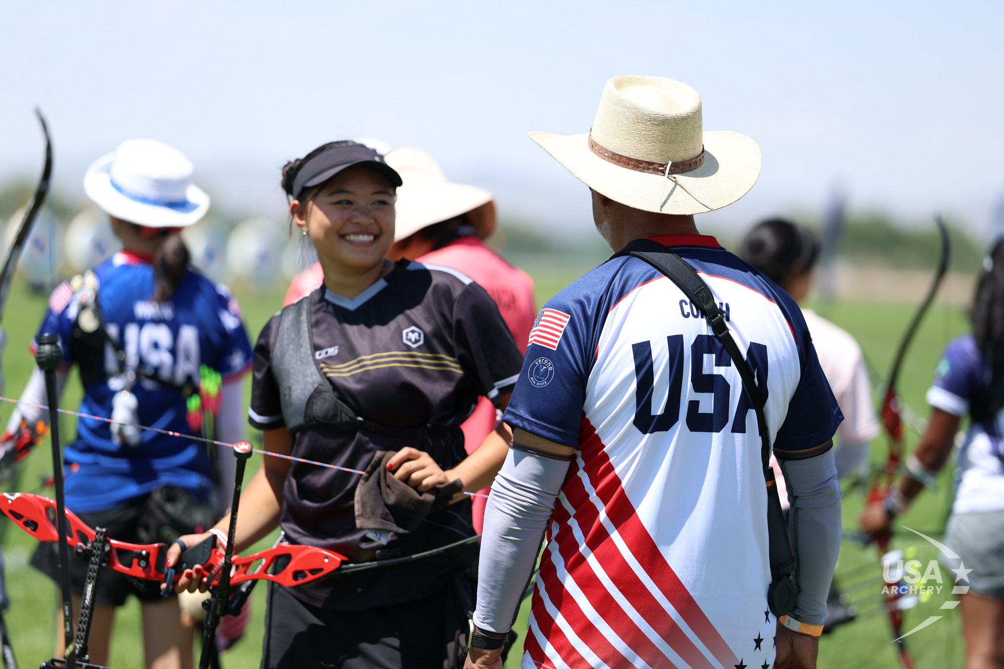 An archer speaks with a coach at the 2025 JOAD Target Nationals